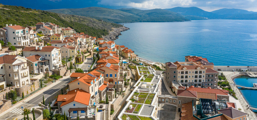 This image has an empty alt attribute; its file name is Marina-Village-sea-view-apartments-in-Montenegro-1024x478.jpg